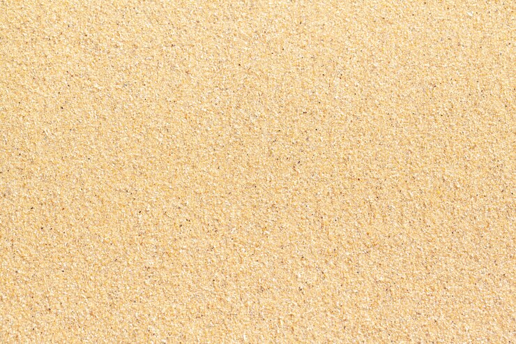 Textured wet sand beach background
