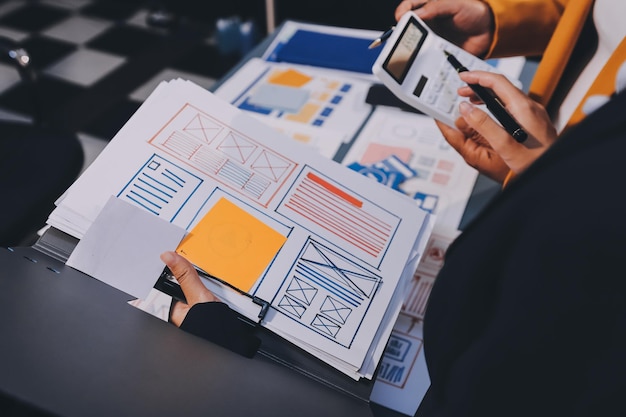 the designer team is designing the uxui system to make the uxui system work well on new phones and support system updates website development concept ui ux front end designer