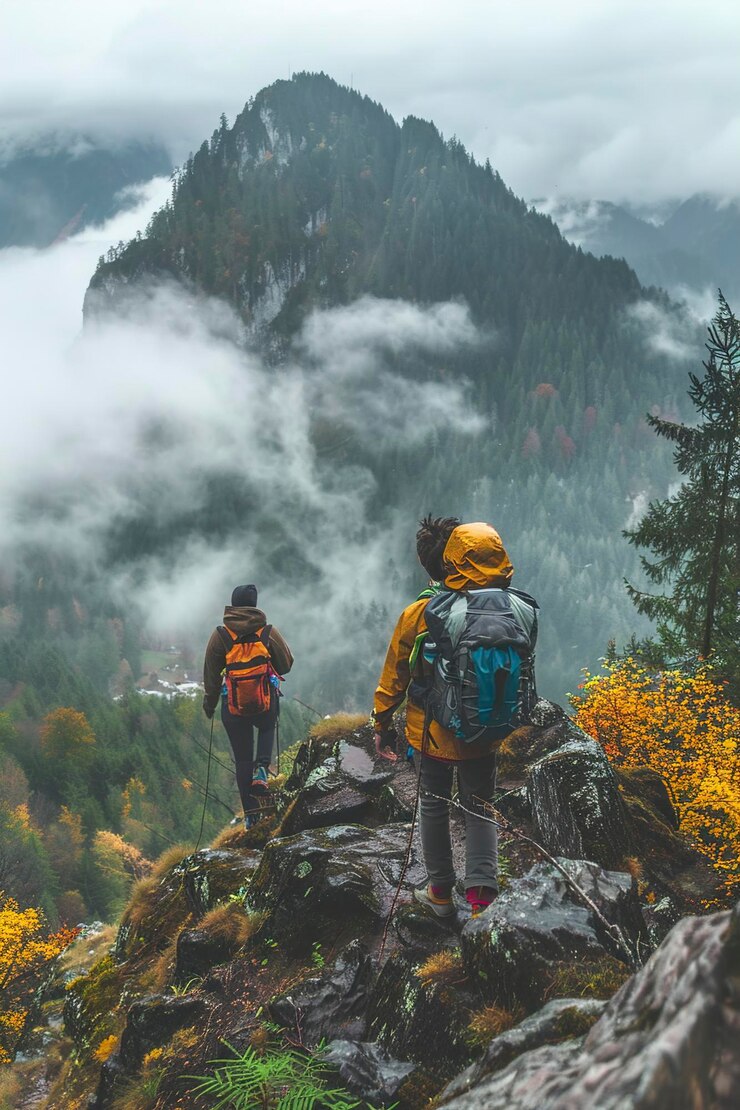 Three People Standing on Mountain Top