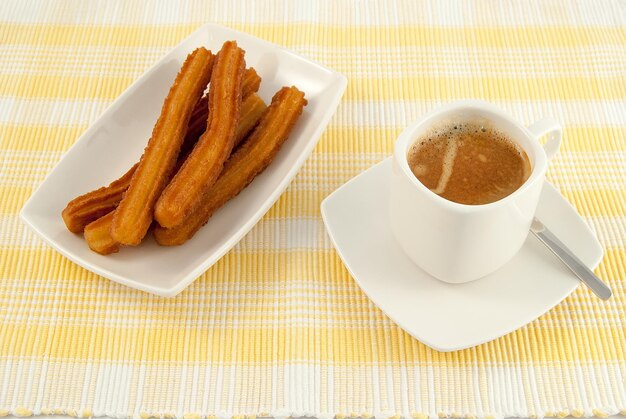 Tipico desayuno espanol cafe con churros