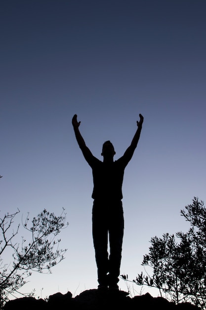 Top of hill man silhouette