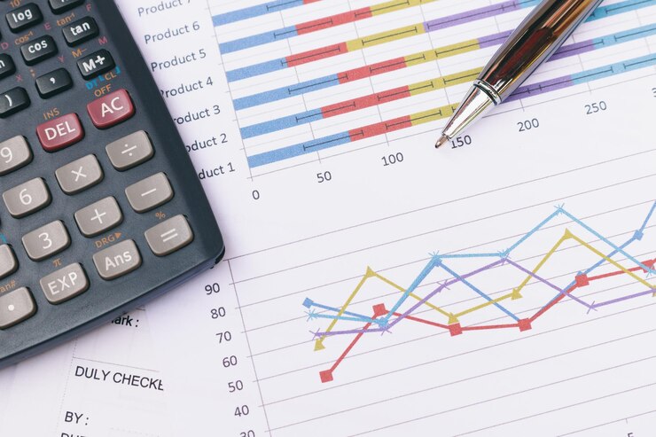 Top viewClose up business concept Pen is on summary report and calculator on table office