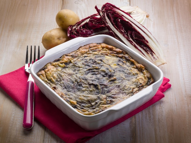 Torta con patate e cicoria