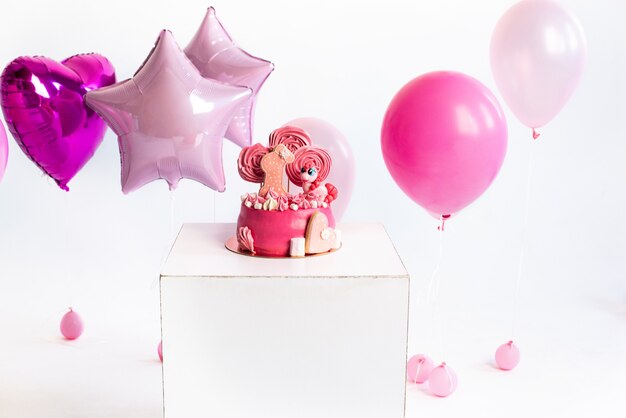 Torta rosa per il compleanno di una bambina di un anno Unicorno di palloncini