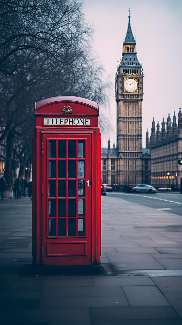 traditional telephone booth in London with Big Ben in the background