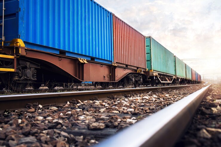Photo train wagons carrying cargo containers for shipping companies