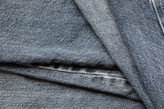 Trama astratta dettagliata del panno in denim blu scuro Immagine di sfondo del vecchio tessuto usato per pantaloni in denim