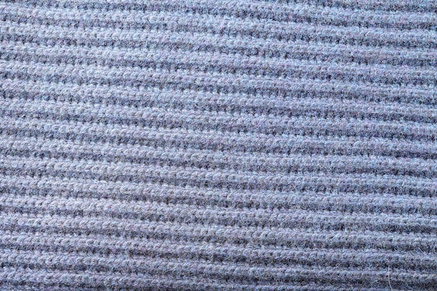 Trama astratta di morbido tessuto a maglia con motivo a spina di pesce per sfondi di colore grigio