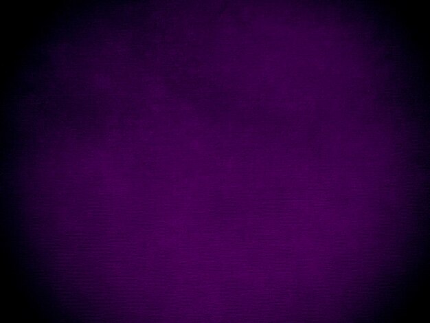 Trama del tessuto di velluto viola scuro utilizzato come sfondo Tessuto panne di colore viola sfondo di materiale tessile morbido e liscio velluto schiacciato tono magenta di lusso per la seta
