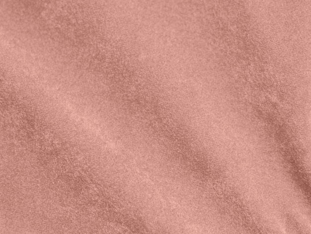 Trama del tessuto in velluto color oro rosa utilizzato come sfondo Vuoto tessuto oro rosa sfondo di materiale tessile morbido e liscio C'è spazio per il testo