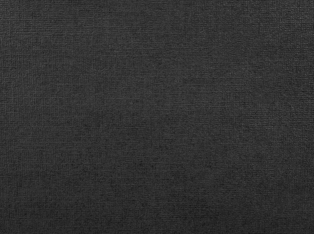 Trama di carta nera. Sfondo di materiale scuro realizzato in cartone.