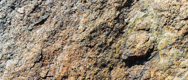 Trama di granito. Struttura della roccia naturale. Priorità bassa di pietra astratta. I colori della terra