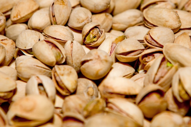 Trama Di Pistacchio. Noccioline. Pistacchi freschi verdi come struttura