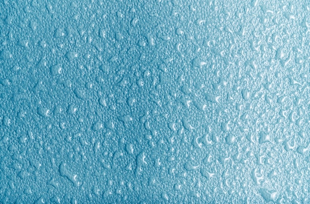 Trama di sfondo astratto blu ricoperta di gocce di pioggia per condensazione
