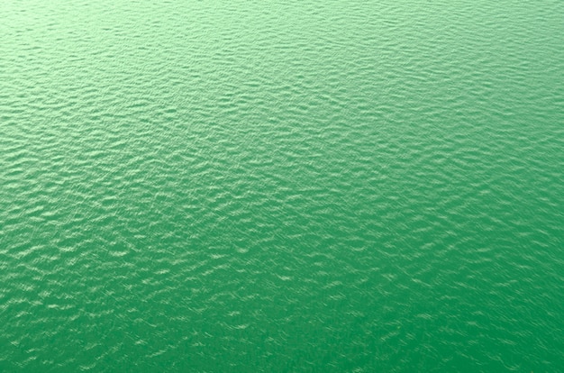 trama di sfondo della superficie dell&#39;acqua in colore verde