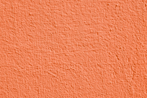 Trama di stucco arancione di un muro