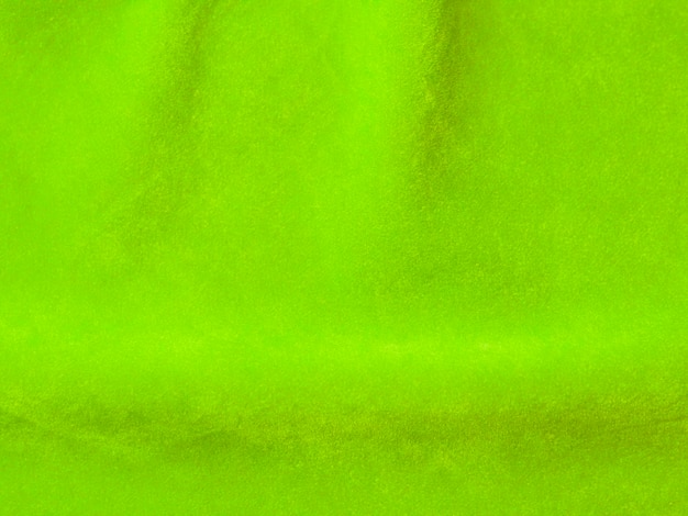 Trama di tessuto di velluto verde chiaro utilizzato come sfondo Vuoto tessuto verde sfondo di materiale tessile morbido e liscio C'è spazio per il testo