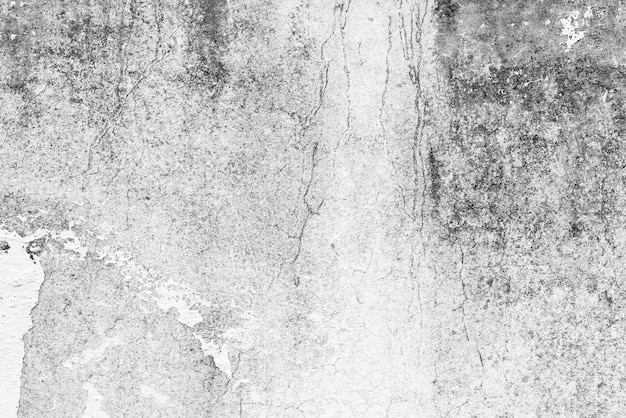 Trama di un muro di cemento con crepe e graffi sullo sfondo