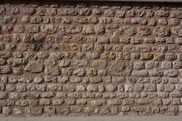Trama di un muro di pietra Vecchio muro di pietra texture di sfondo Muro di pietra come sfondo o texture