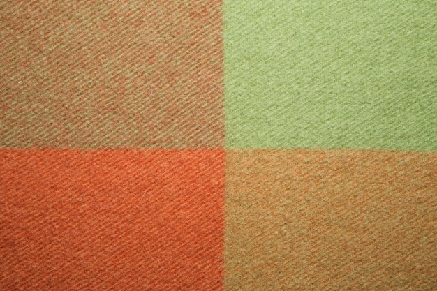 Trama plaid di lana verde e arancione