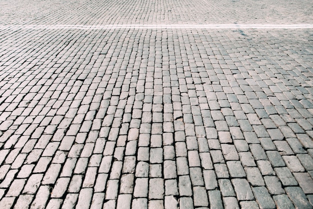 Trama quadrata in pietra per pavimentazione.