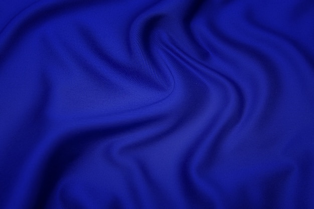 Trama ravvicinata di tessuto o stoffa blu naturale dello stesso colore. Trama del tessuto di cotone naturale o seta o materiale tessile di lana. Sfondo di tela blu.