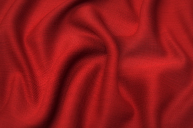 Trama ravvicinata di tessuto o stoffa rosso o rosa naturale dello stesso colore. Trama del tessuto di cotone naturale, seta o lana o materiale tessile di lino. Sfondo di tela rossa e arancione.