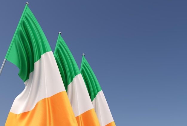 Tre bandiere dell'Irlanda sul pennone su sfondo blu Posto per il testo La bandiera si sta spiegando nel vento Dublino Europa irlandese 3D illustrazione