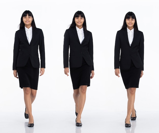 Tre collage Tutta la lunghezza degli anni '20 Affari asiatici in ufficio Donna nera capelli corti indossare gonna abito scuro e scarpe. Camminata femminile verso la telecamera su sfondo bianco isolato