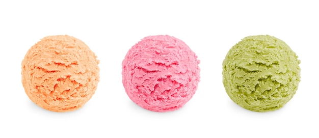Tre palline di gelato freddo da dessert di colore rosa, verde e marrone chiaro di diverso sapore