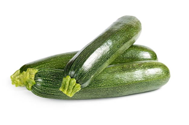 Tre zucchine mature isolate su sfondo bianco