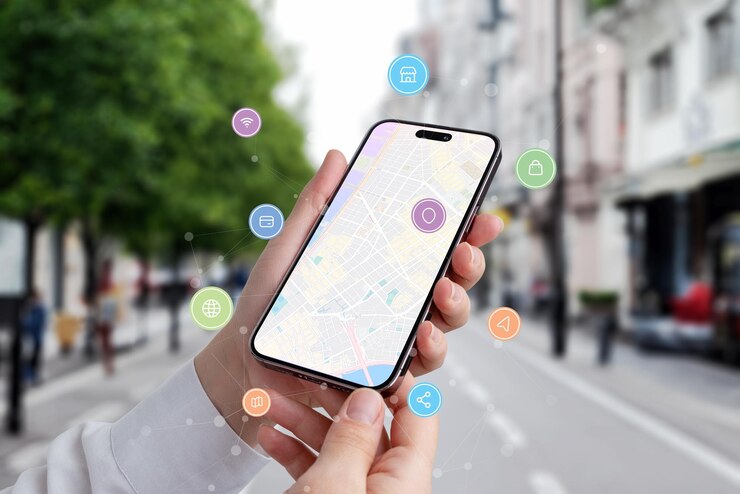 Foto trova una posizione tramite un concetto telefonico mappa della città sul display del telefono con icone e nodi di rete che volano intorno