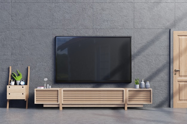 TV on Cabinet nella moderna stanza vuota con muro di cemento e pavimento