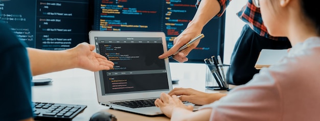 Two smart computer engineers working together to solve program code Burgeoning