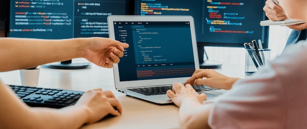 Two smart computer engineers working together to solve program code Burgeoning