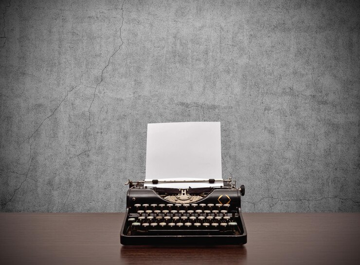 Typewriter with blank paper