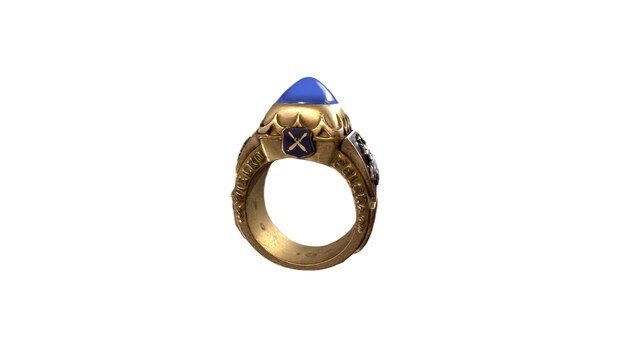 Un anello d'oro con una pietra blu e una stella blu in cima.