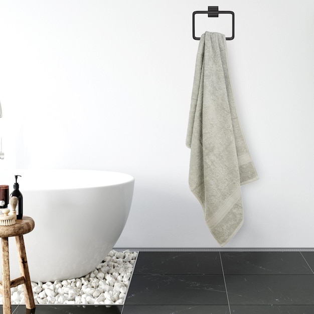 Un bagno con un asciugamano appeso al muro e un supporto con sopra un asciugamano