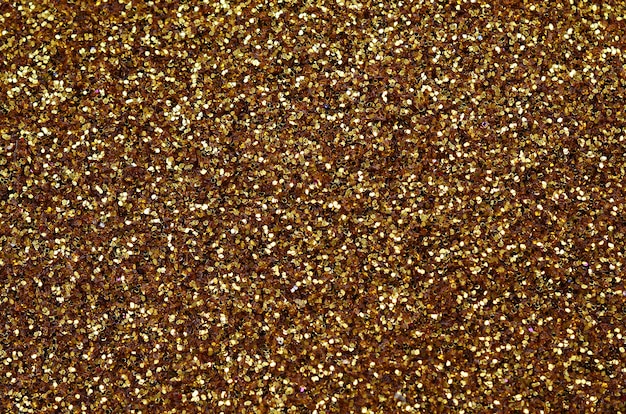 Un&#39;enorme quantità di paillettes decorative gialle. sfondo