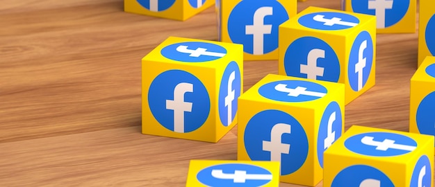 Un gruppo di cubi gialli e blu con facebook sopra