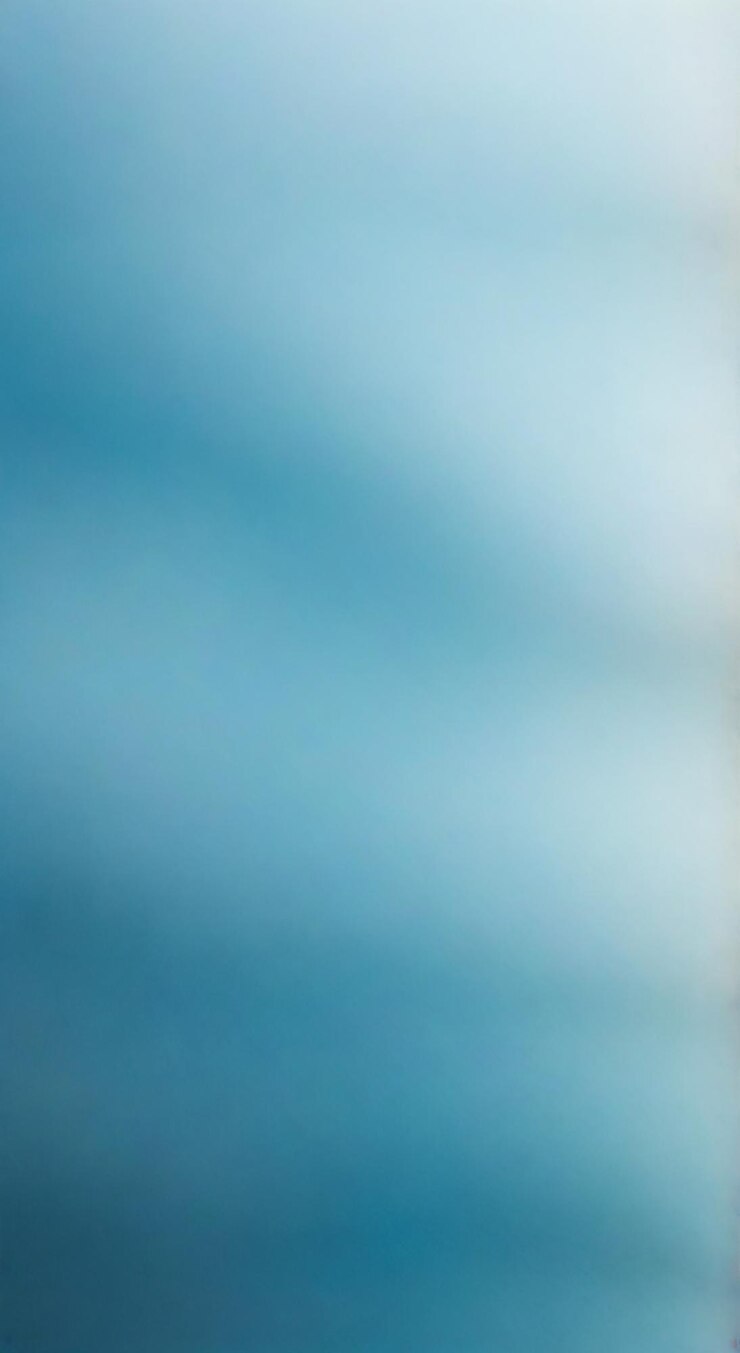Foto un'immagine blu e bianca di un cielo con un albero in esso