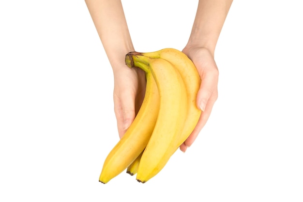 Un mazzo di banane in mano di donna isolato su uno sfondo bianco