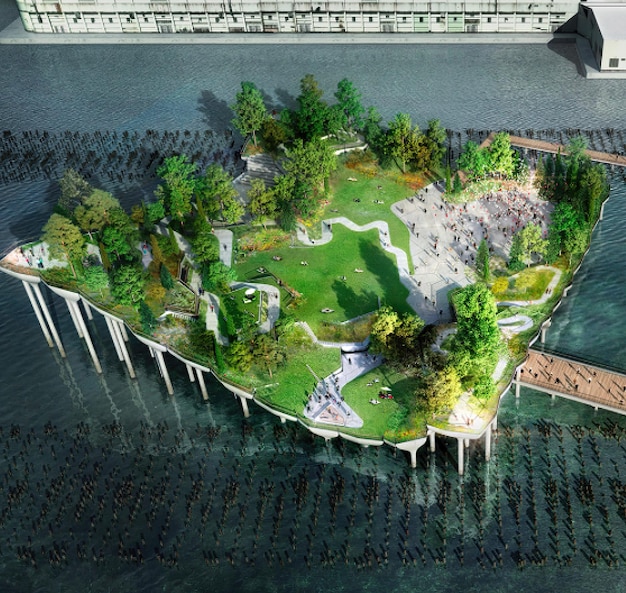 un modello di una piccola isola con un ponte sullo sfondo