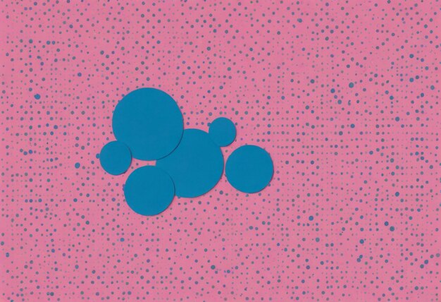 Un motivo a pois con pois blu su sfondo rosa