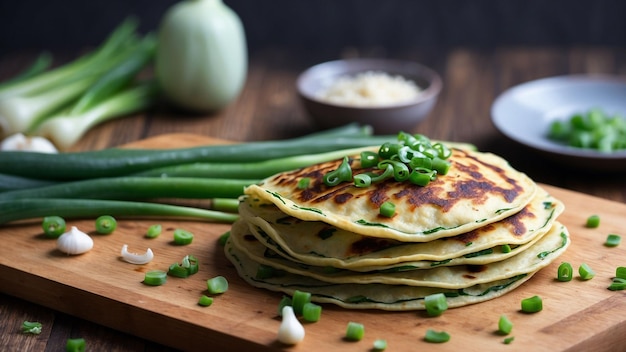 un mucchio di cipolle fresche di primavera su una tavola da taglio in legno crea una ricetta per la cipolla di primavera salata pa