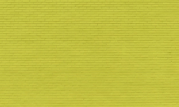 Un muro di mattoni gialli fatto di mattoni gialli brillanti.
