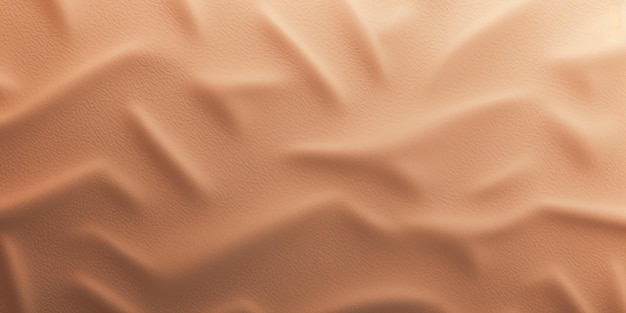 Un primo piano di una duna di sabbia con un disegno onda in background.
