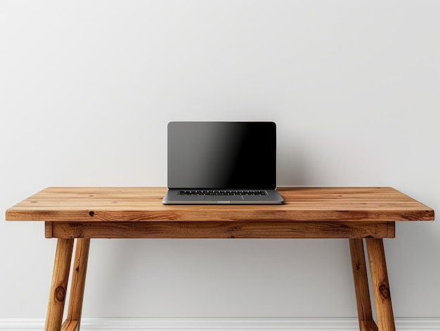 Un tavolo in legno in stile minimalista con un portatile aperto posto sulla superficie