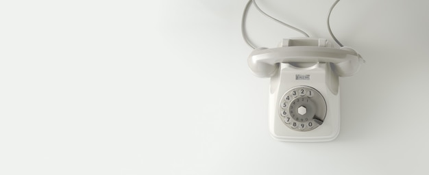 Un telefono con linea vintage bianco con sfondo bianco.