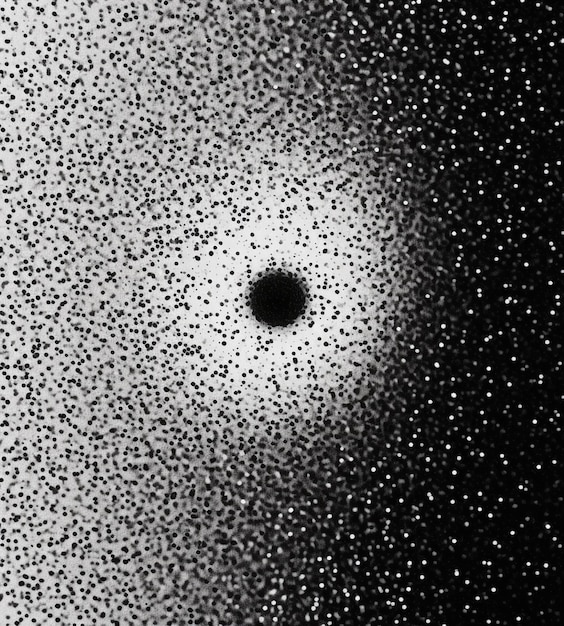una foto in bianco e nero di un buco nero nel cielo generativa ai